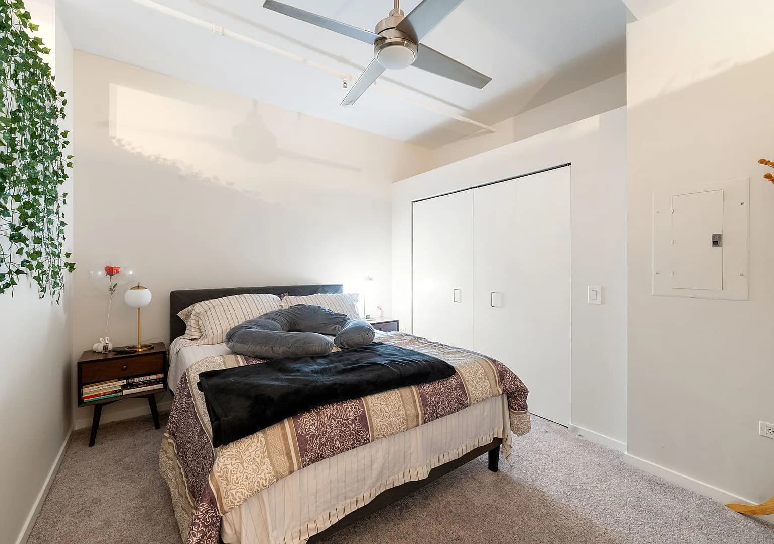 Primary bedroom with carpet and lofted ceiling